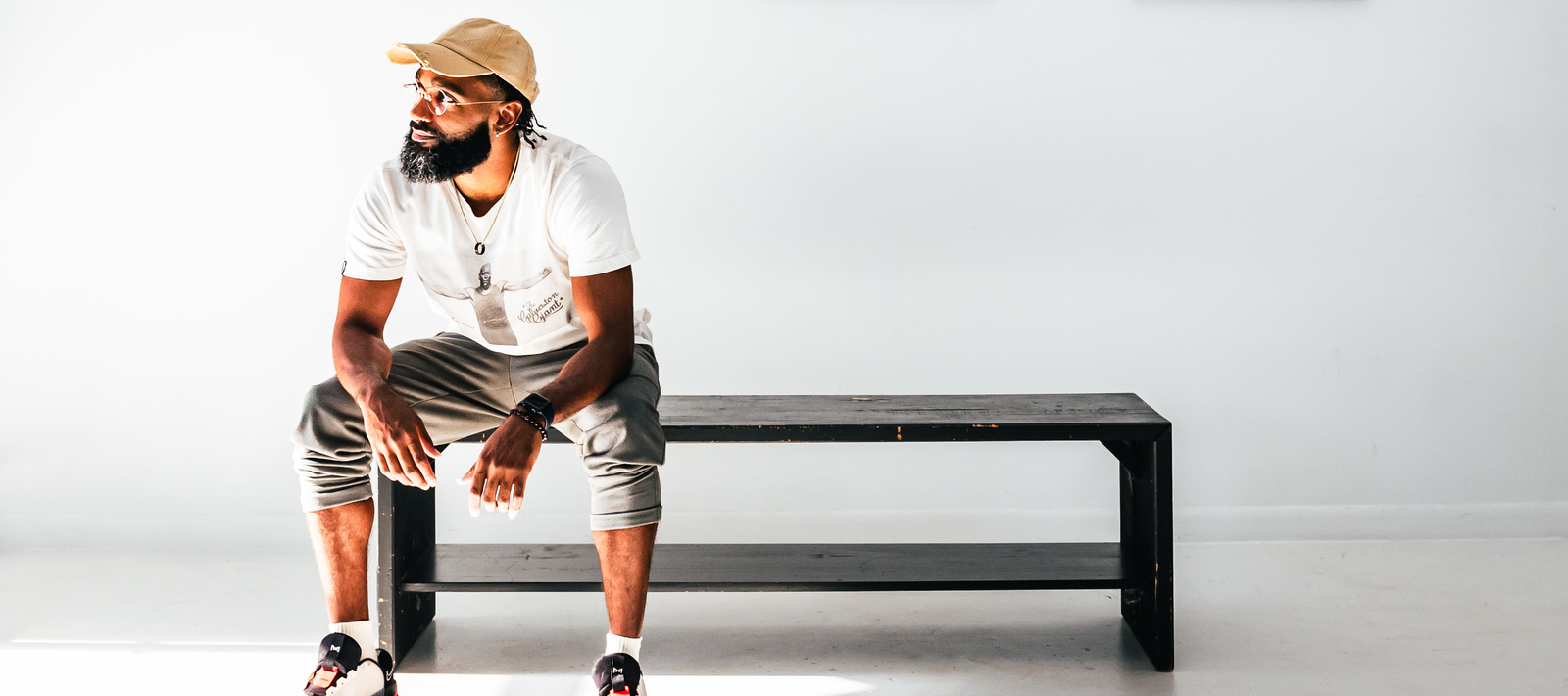Kinan D. Adams sitting on a black bench